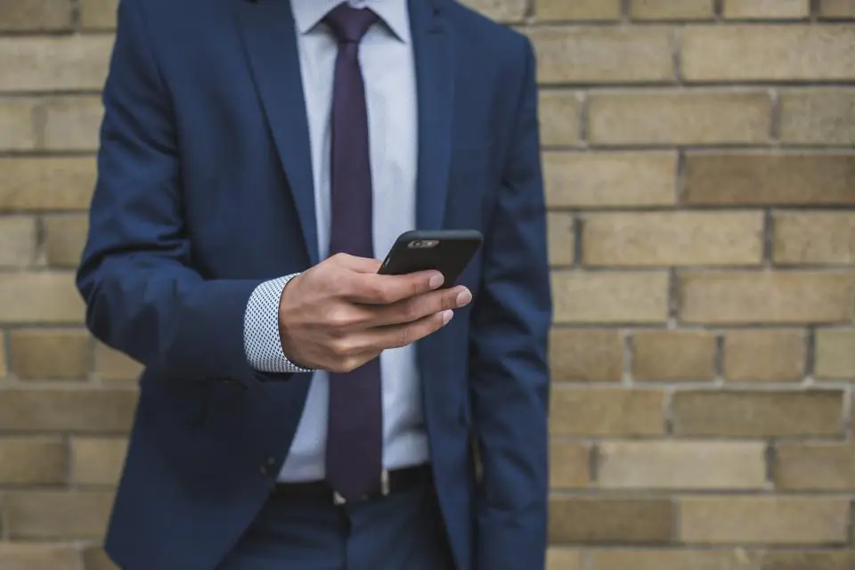 Insurance advisor checking his phone