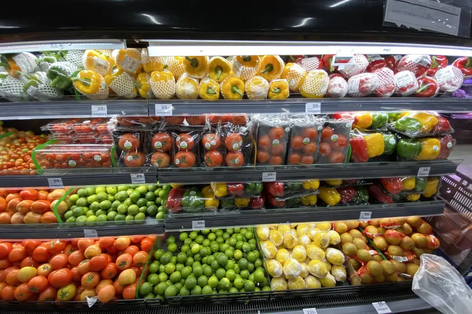 Supermarket shelf with fruits and vegetables
